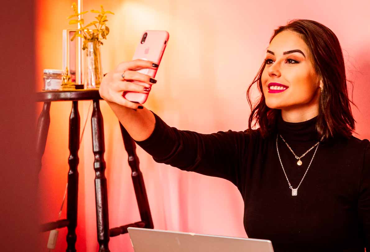 Woman with a necklace taking a selfie