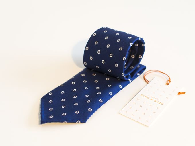 ​Blue handrolled floral tie.​