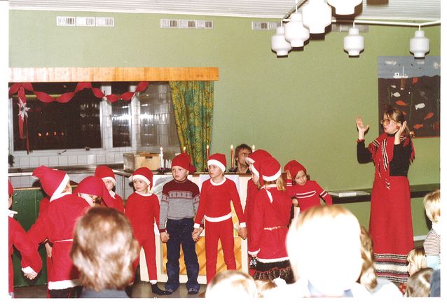 Photo:  Caption: A puzzled Finnish boy wearing a quintessentially Finnish ‘Jussi’ shirt at a Christmas party in Västerås, Sweden in 1977. Photo: Maija Parviainen.​