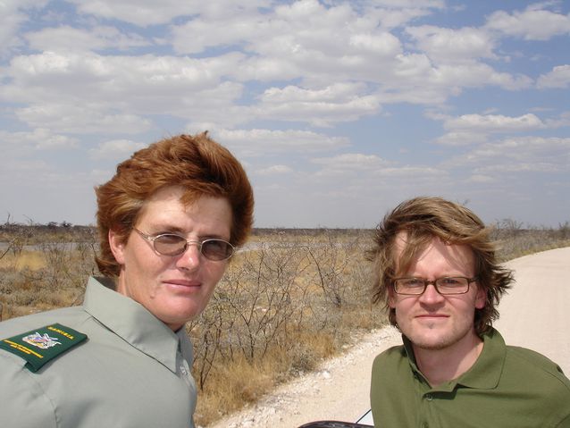 Janne Hopsu posing with a wildlife guard in the Namibian national park Etosha.​