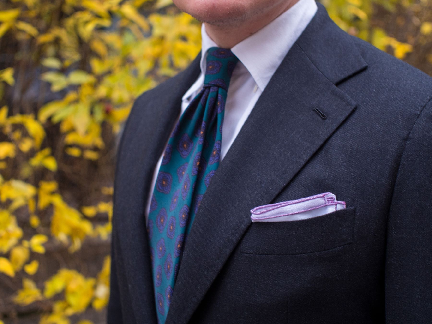 dark grey suit with teal tie