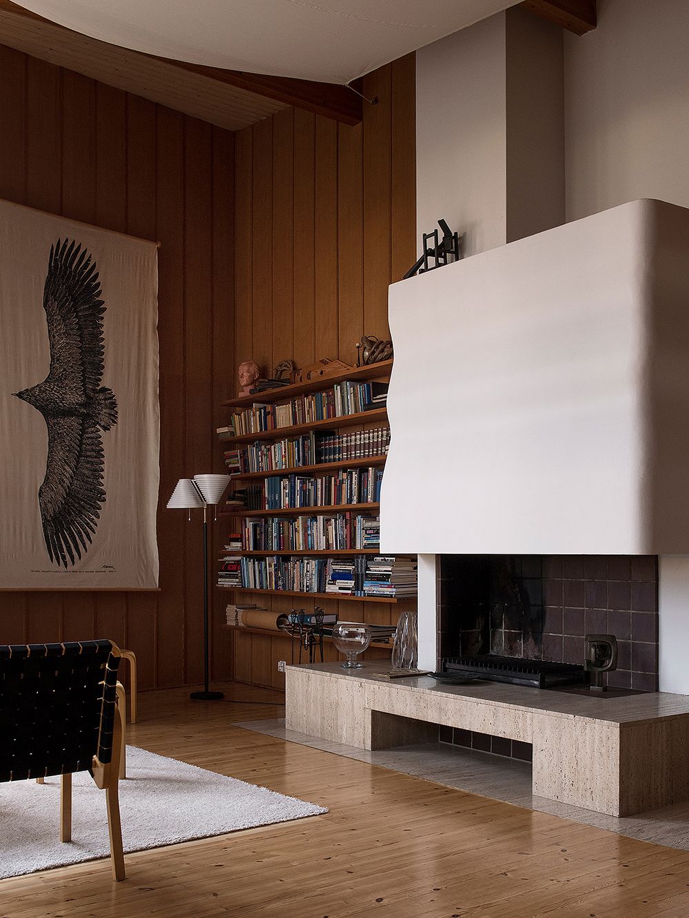 An open fireplace in the study of Villa Kokkonen