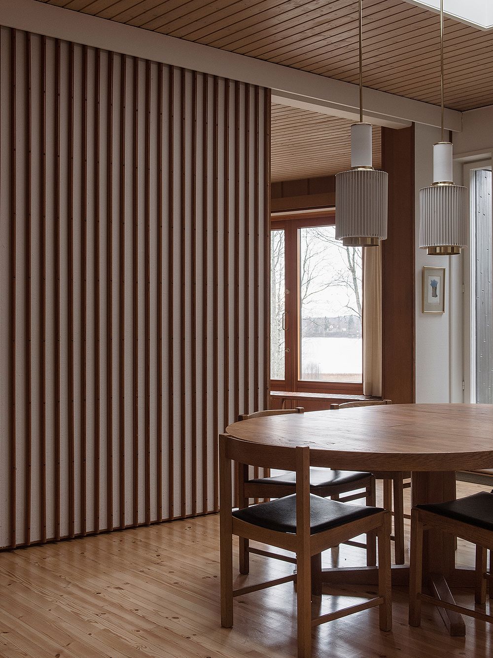 A dining room with a sliding door