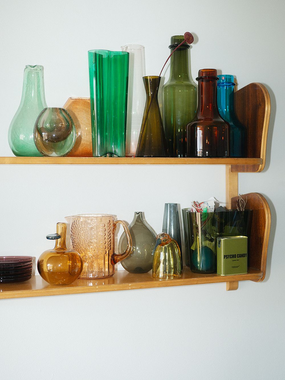 Glass objects on an Artek wall shelf