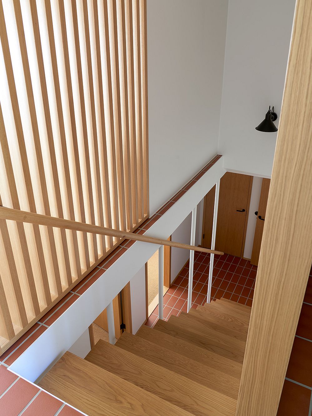 A wooden lattice next to stairs