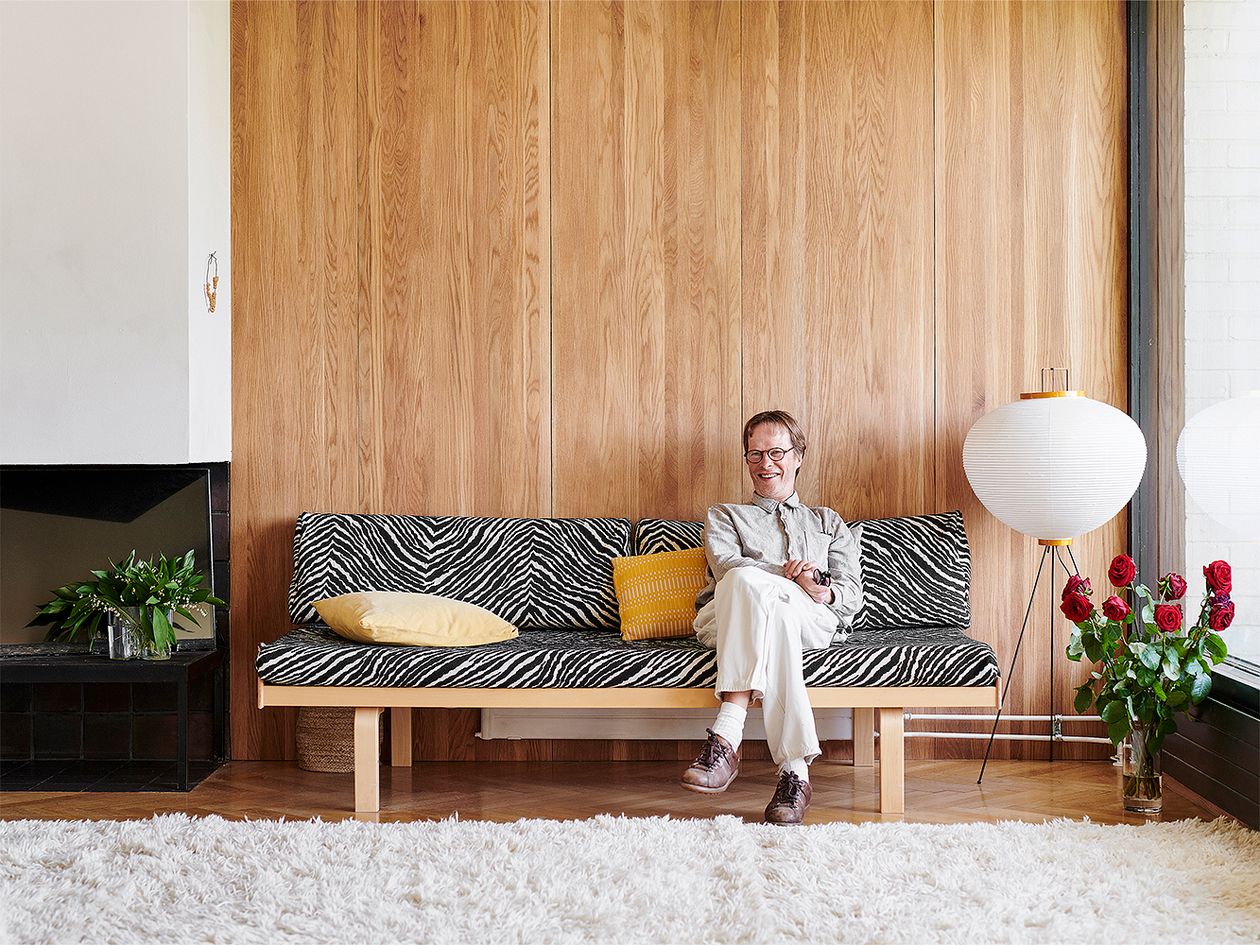 Pekka Jylhä sitting in his living room