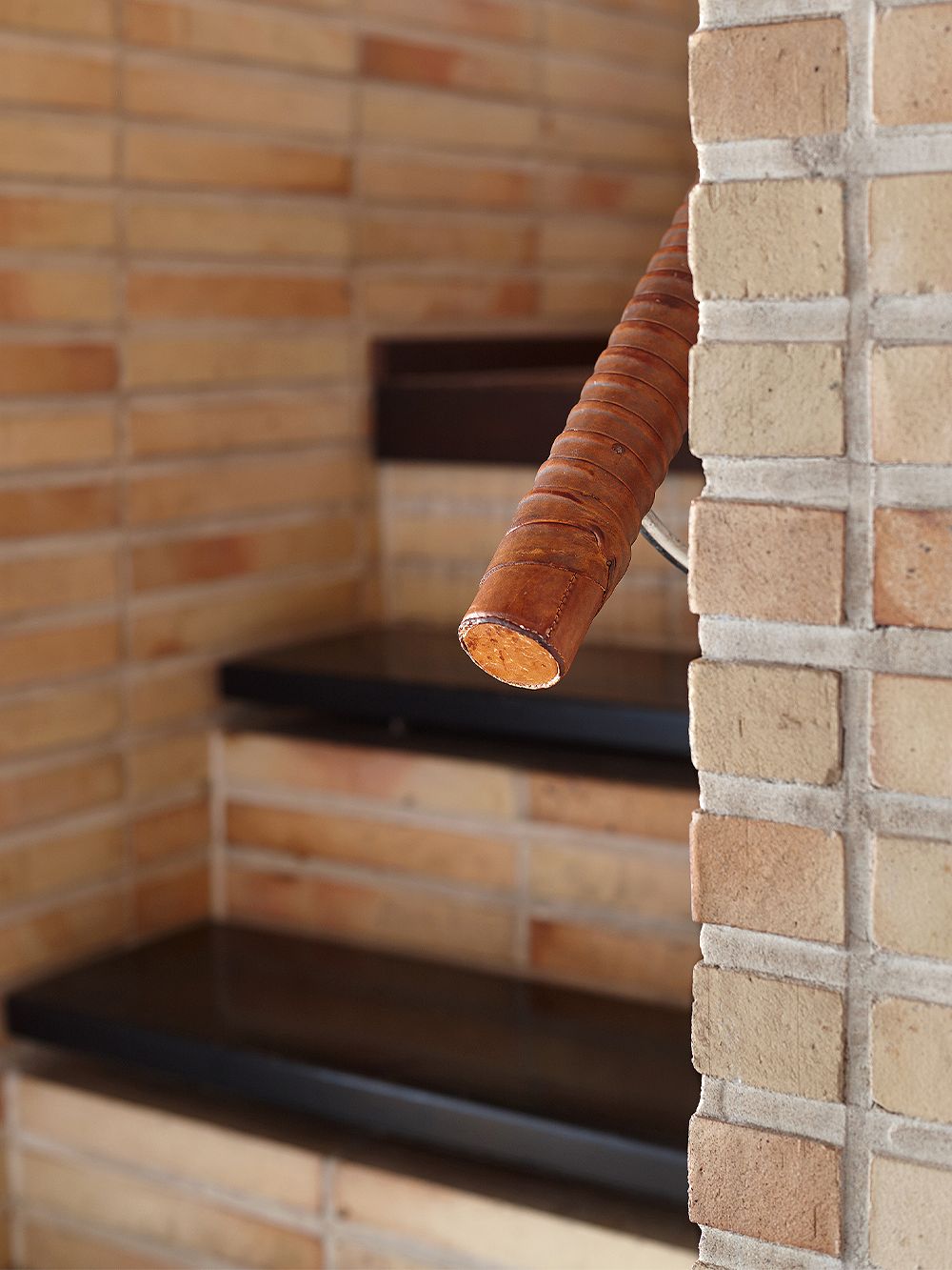 A detail of a leather-coated handrail