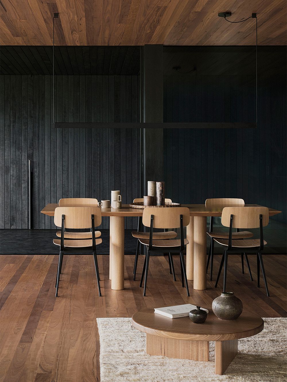 An image of Federal House's dining area, featuring HAY's Result dining chairs around a wooden table, as part of the dining room decor.