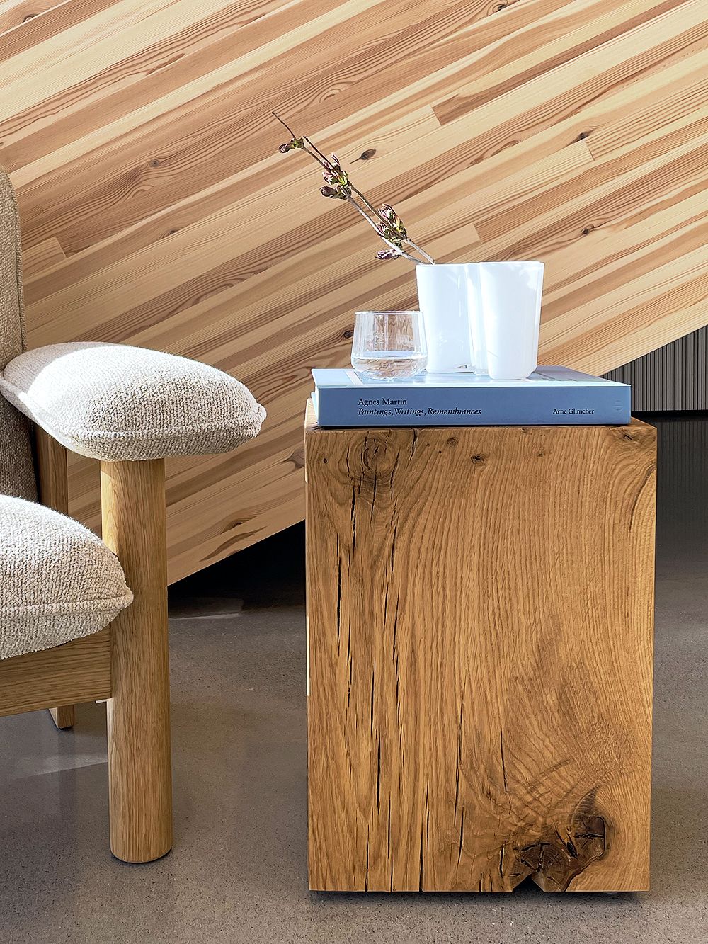 Nikari Biennale stool used as a side table next to Menu's Brasilia lounge chair