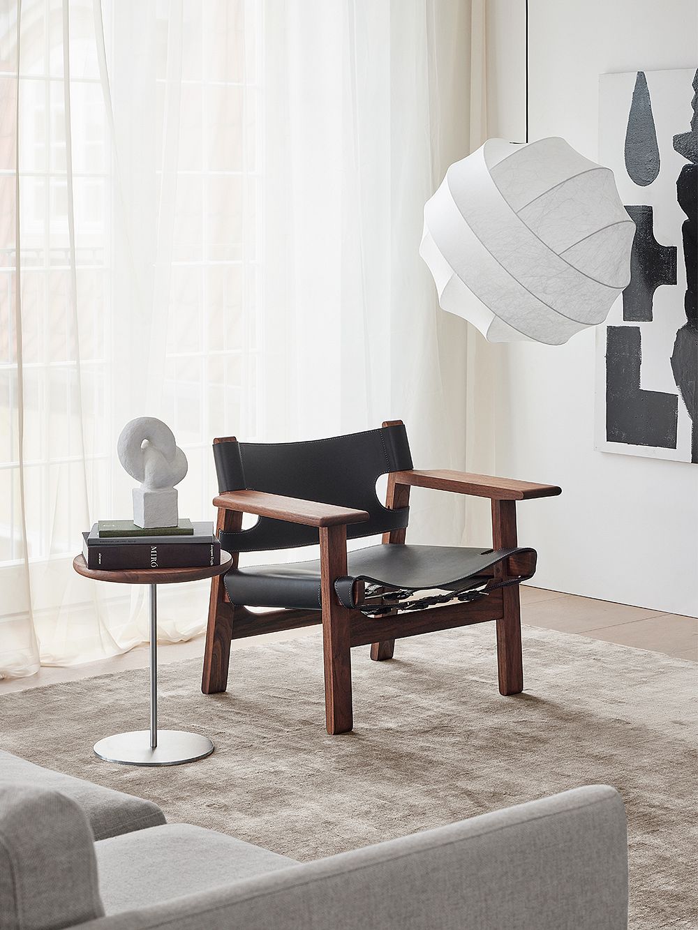 Fredericia's The Spanish Chair, black leather - oiled walnut