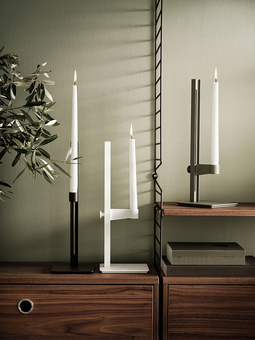 String Furniture's Museum candleholder in black, white, and dark brown.