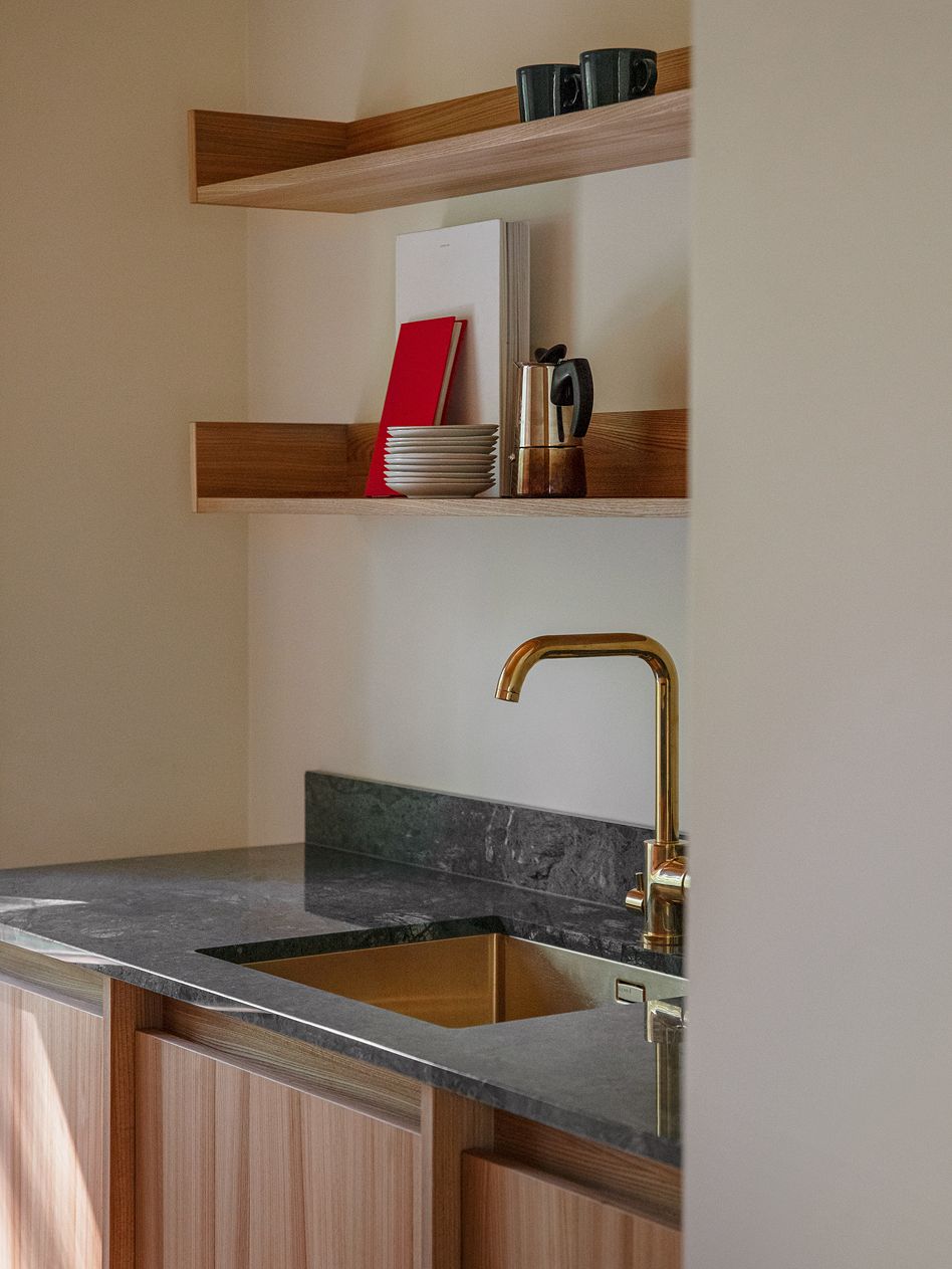 A brass faucet in the kitchen