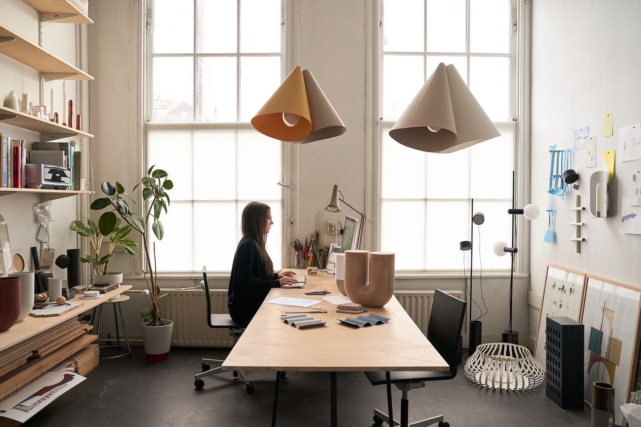 Rachel Grifiin at her desk in her workspace.