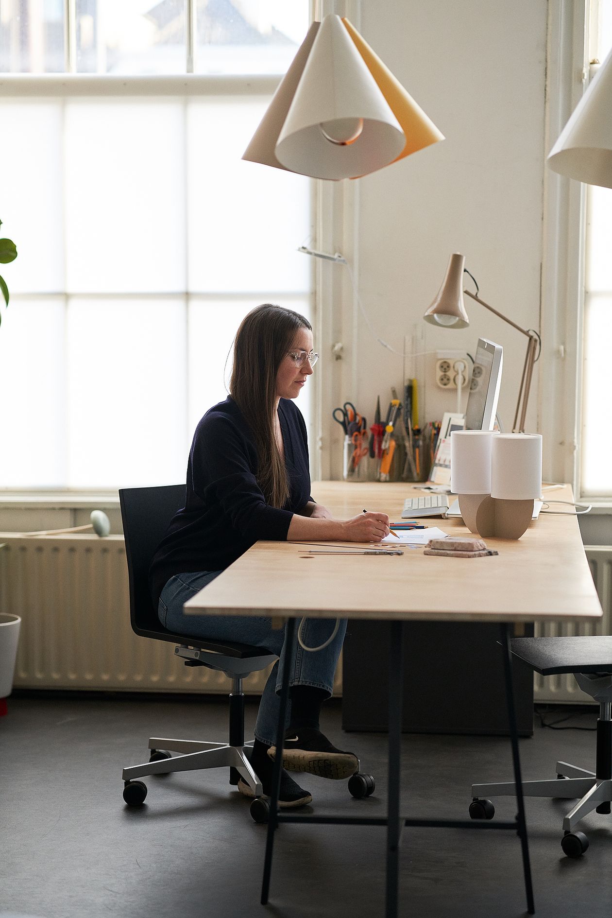 Rachel Griffin at her desk at her studio.