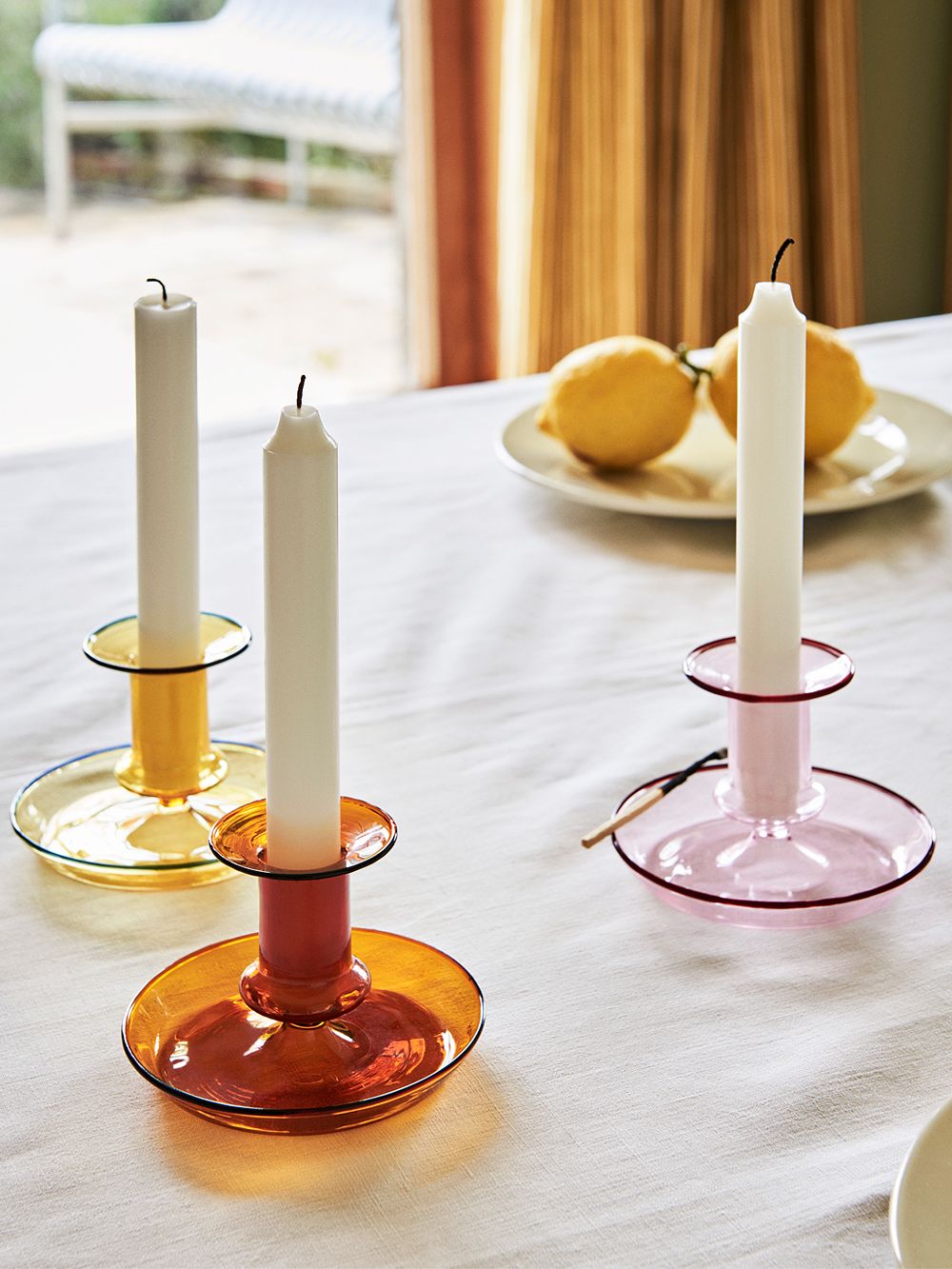 Hay's Flare candle holders in three spring colors on a table.