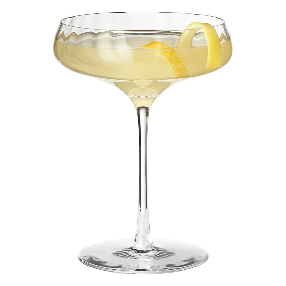 Product picture of Georg Jensen's Bernadotte cocktail glass filled with yellow cocktail