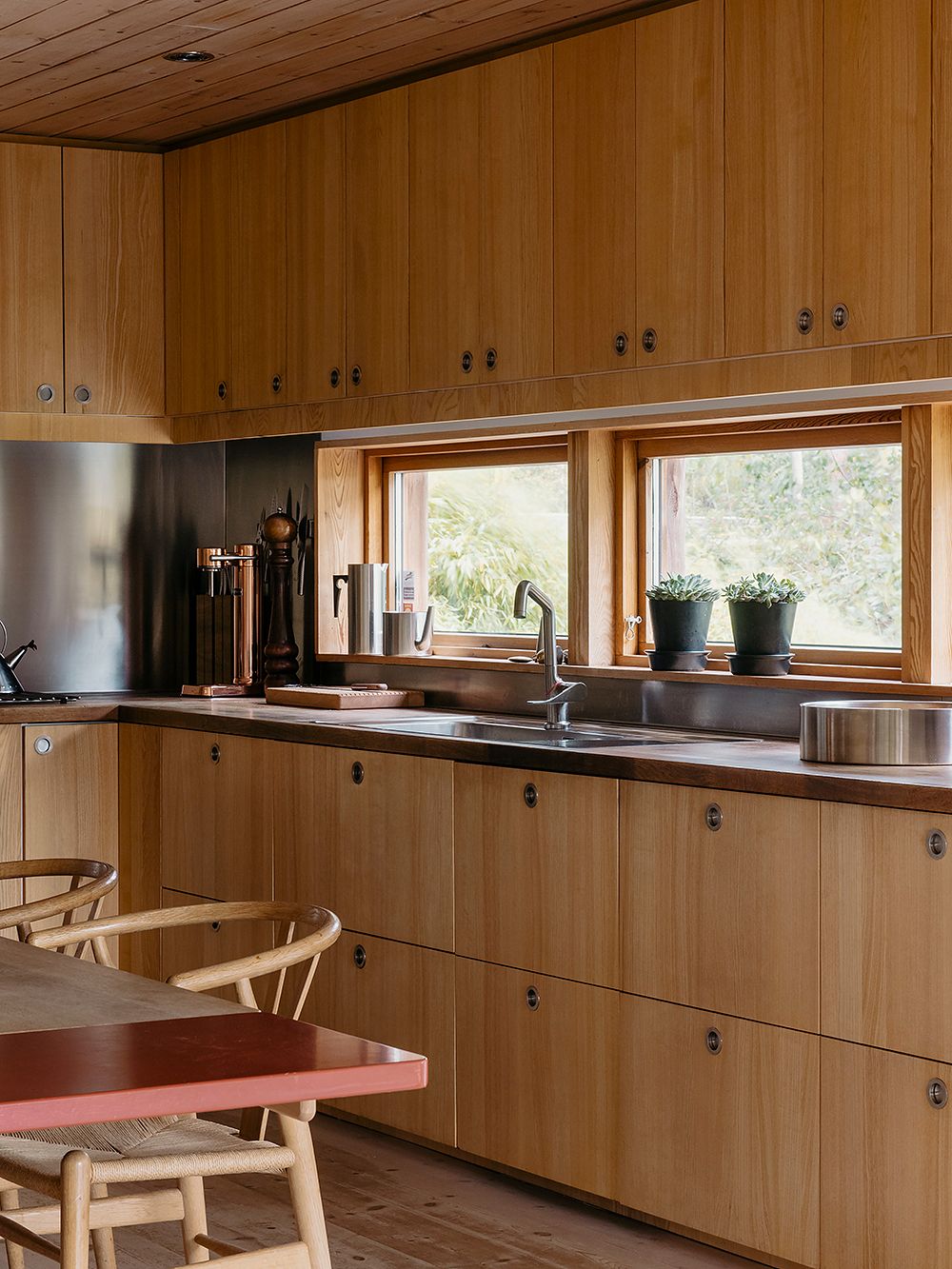 A view of the kitchen with wooden cabinets