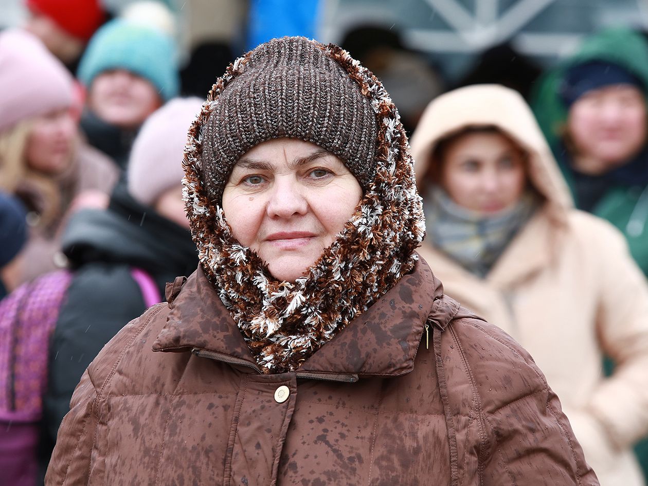 Ukrainian woman staring at the camera wearing winter clothes
