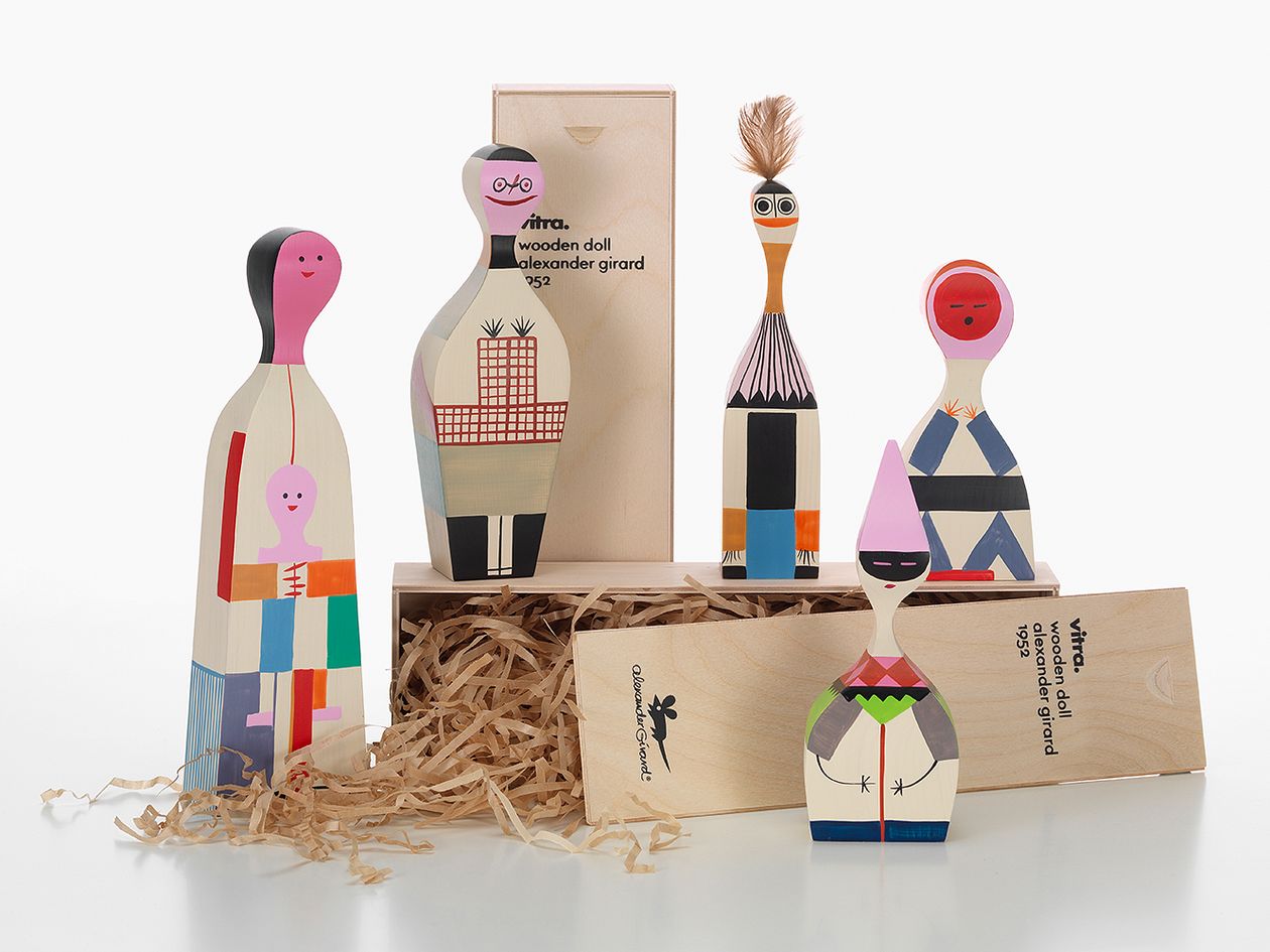 Five wooden dolls by Vitra and two wooden gift boxes