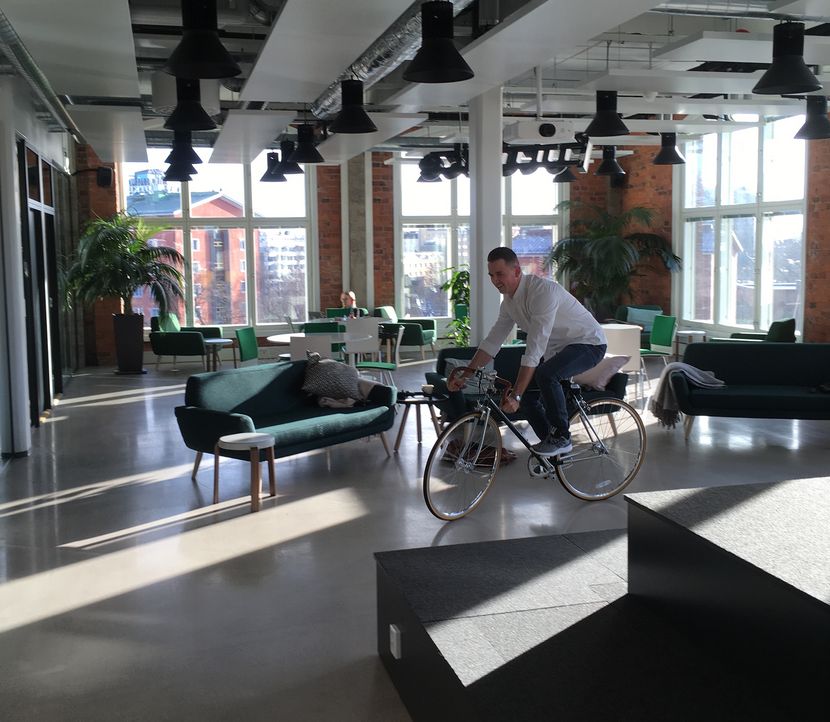 Casually test-driving a bicycle at the office