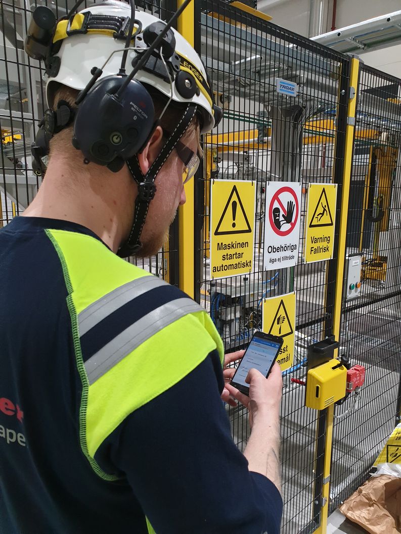 Raumaster Paper automation engineer Harri Honkanen completing a personal risk assessment on site