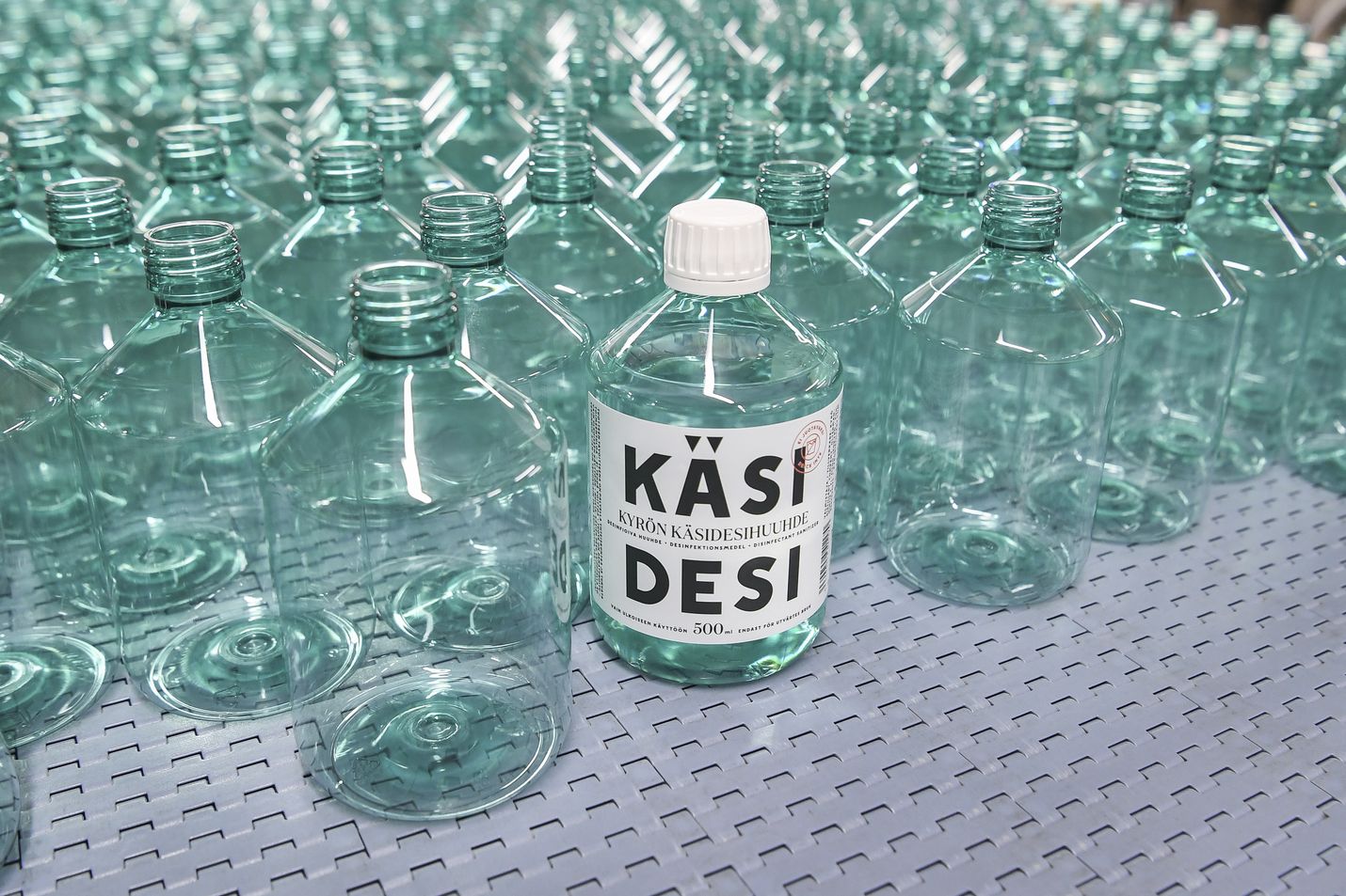 No more gin tonics, it's sanitizers now. A labeled bottle full of hand sanitizer among countless unlabeled and empty bottles at the distillery of the Kyro Distillery Company, known for producing the popular Kyro Gin.