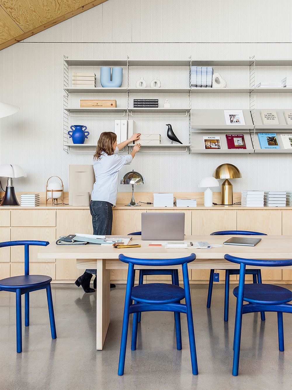 An image of Finnish Design Shop's showroom, featuring interior architect Maija Rasila.