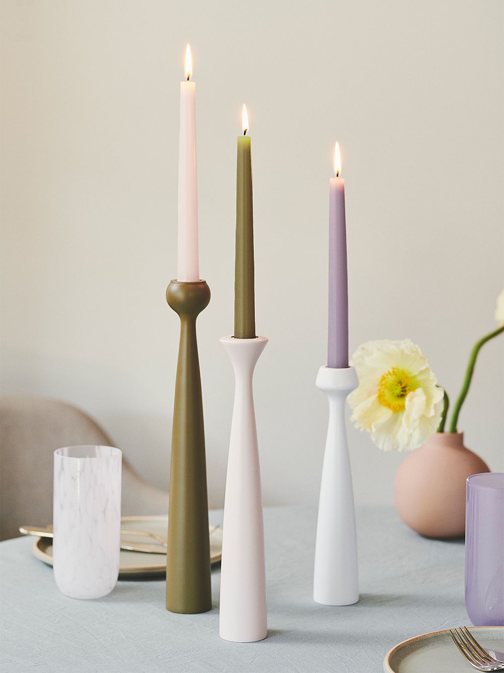 An image of applicata's Blossom candleholders on a table, as part of the dining room decor.