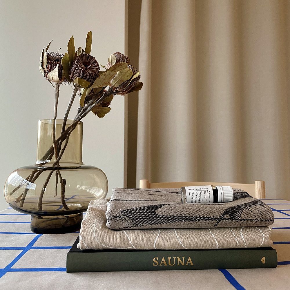 Sauna set: sauna seat cover by Lapuan Kankurit, Hetkinen sauna scent drops, Sauna book
