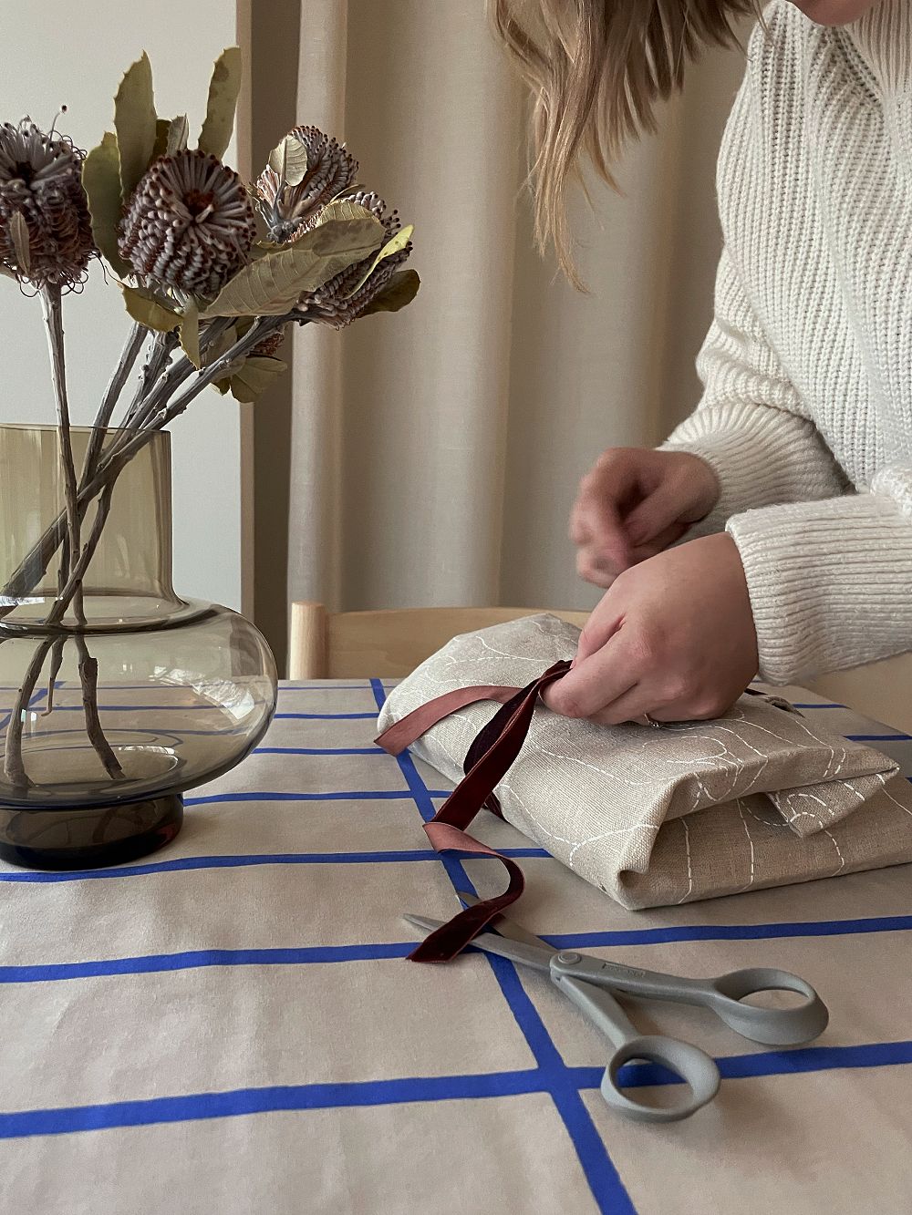 Gift wrapping with a linen tote bag and a velvet ribbon