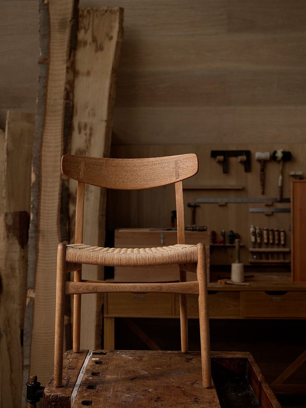 An image featuring Carl Hansen & Søn's CH23 chair in a carpentry workshop,