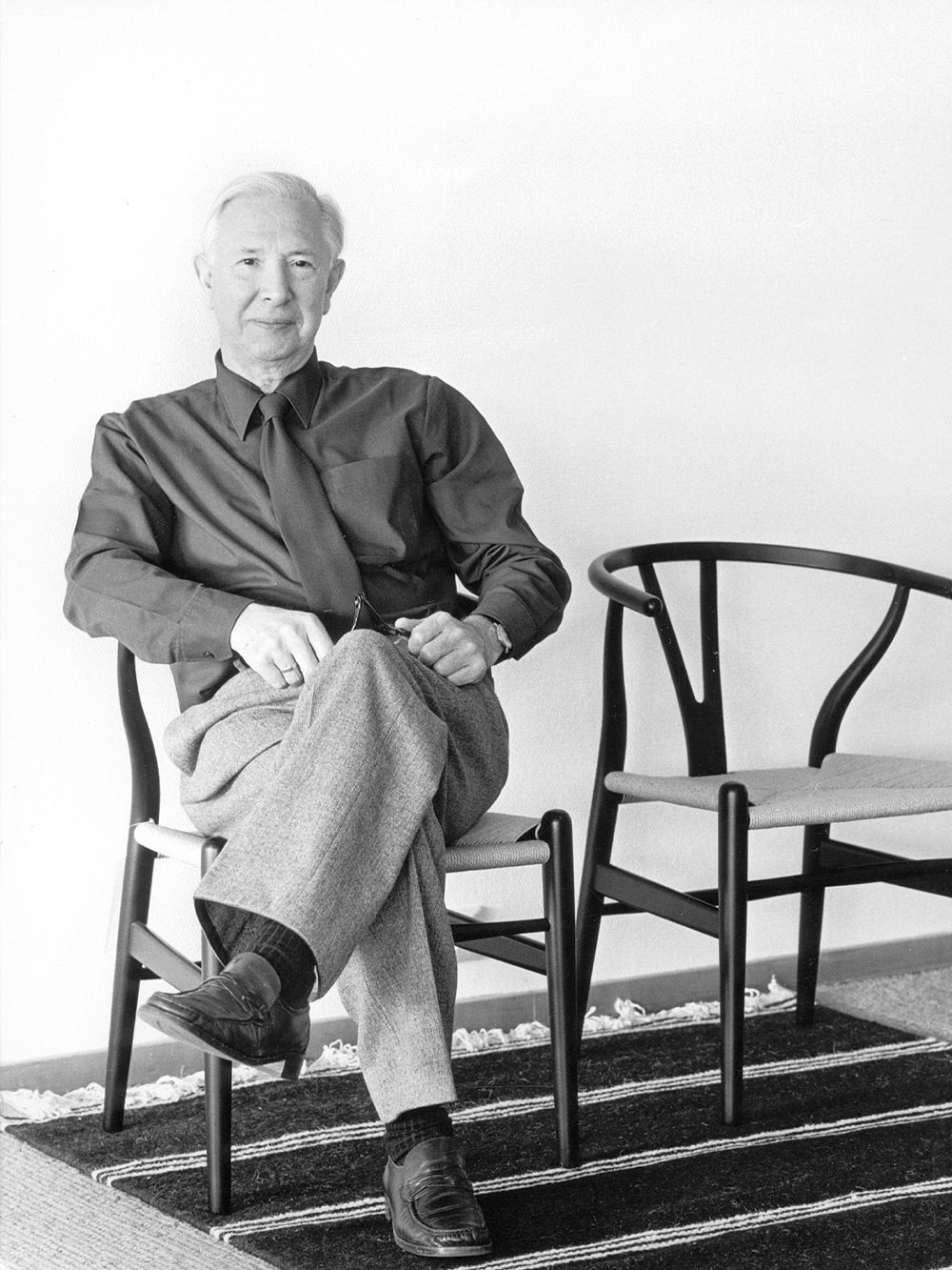 Black and white portrait of designer Hans J. Wegner.