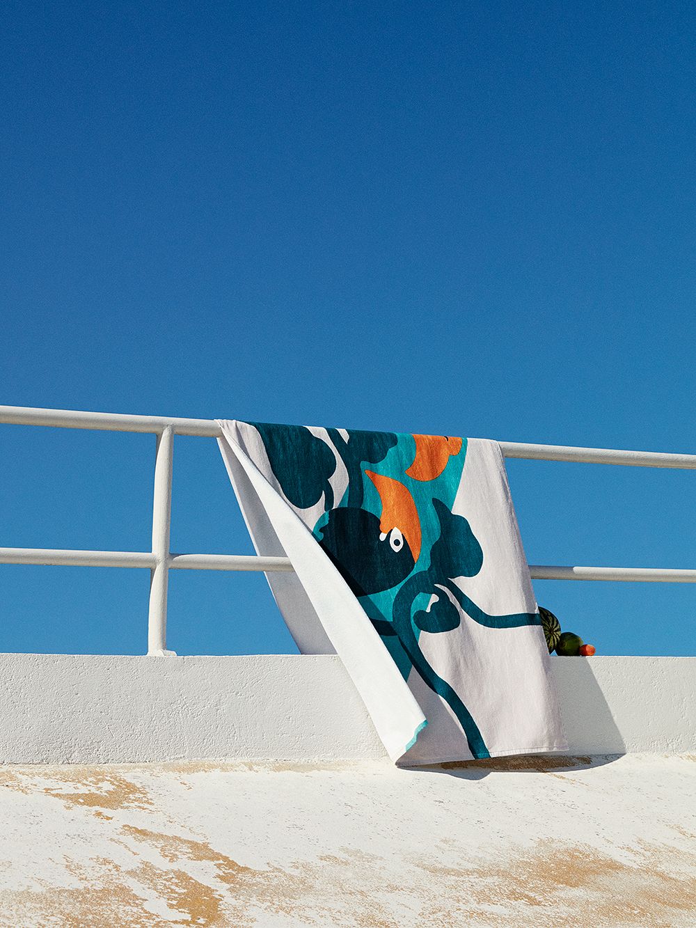 An image of a beach towel with Marimekko's Pepe print.