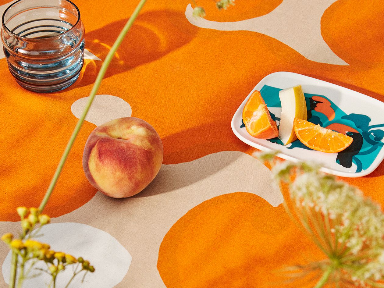 A closeup image of Marimekko's Keidas fabric and Pepe plate.