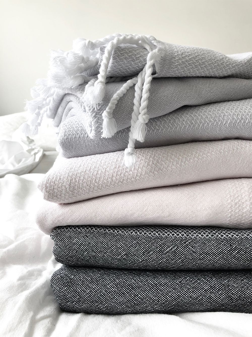Langø cotton towels folded into a pile.
