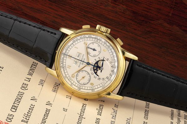 Considered one of the greatest timepieces ever made, the Patek Philippe Ref. 2499 is coveted among watch collectors. This yellow gold example in a Wenger case from the elusive first series is one of only 28 ever made and comes with a rare certificate of origin.