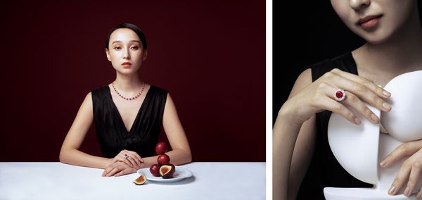 A model poses wearing ruby rings and a ruby and diamond necklace.