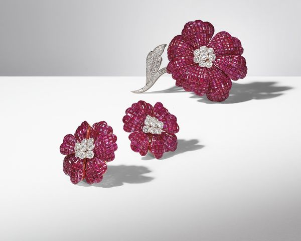 A brooch and pair of earrings in rubies and diamonds highlight the masterful craftsmanship synonymous with Alfredo Aletto and his family's business.
