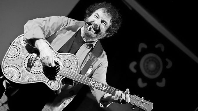 comedian kevin bloody wilson performing with a guitar