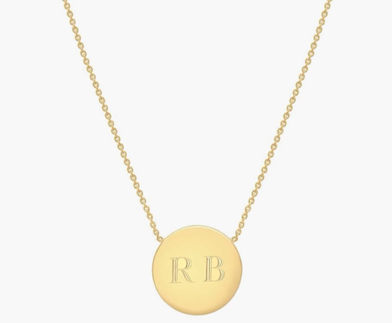 gold necklace with round gold pendant with capital letters R and B engraved